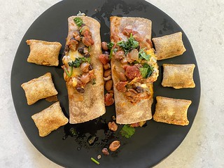 Cooking - Homemade enchiladas. Leftover pizza rolls. Very nutritious