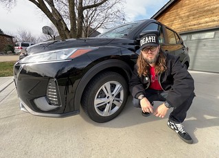 State Farm / Enterprise hooked it up with this lil baby sub-compact 4-door Nissan queef.