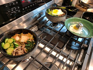 Puttin together some Bibimbap in these hot stone bowls.