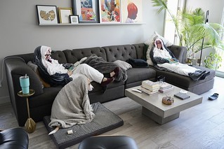 Art - Kari and her cousin are having a “hang out in shark onesies and read books” kind of weekend.