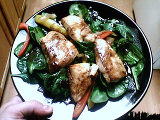 Tilapia over spinach, onion, and peppers with balsamic vinegar