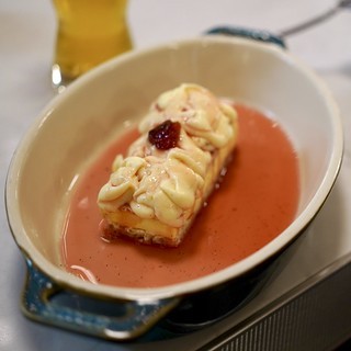 An open faced, strawberry ice cream sandwich
