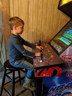 Little dude playing basketball