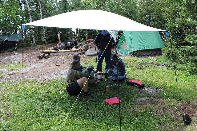 Waiting out some weather under Cal's rain tarp.