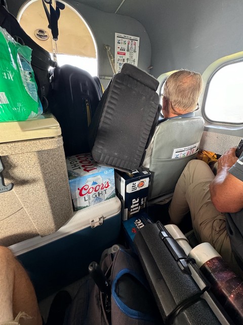 Gear and beer stacked on Tom