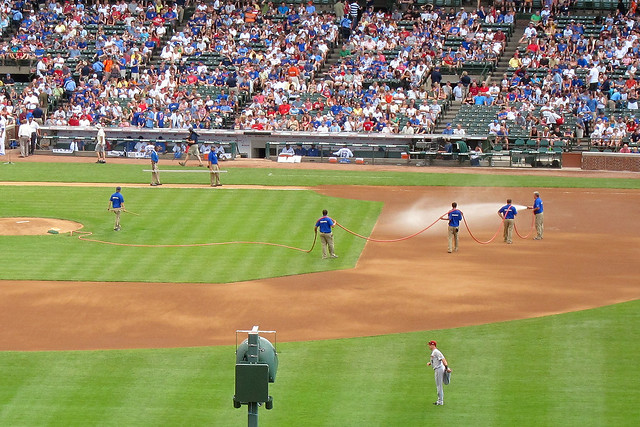 Now that the rain tarp's off, let's dowse the infield with water