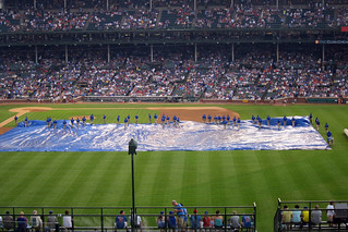 Baseball - Taking off the rain tarp