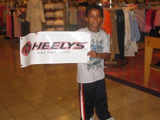 A kid rockin Heelys during the whole Nordstrom's event