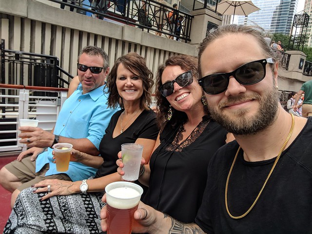 On a boat. With a beer. Bout to go on the architectural tour
