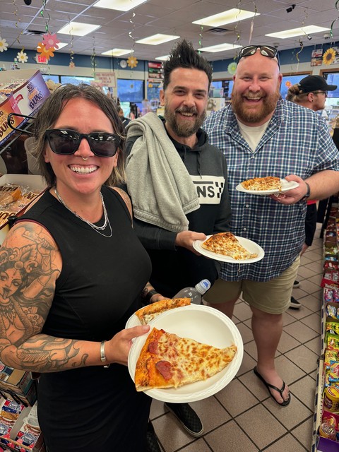 Showing the friends some QC pizza