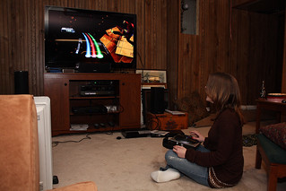 Heather playing DJ Hero