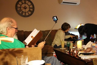 Christmas - Jeff takes selfies of himself reading a book while kari and teresa do Christmas
