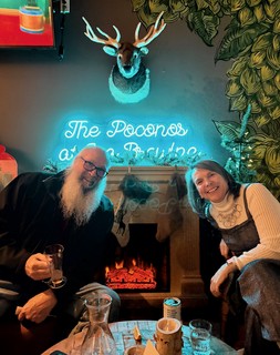 Jeff and Teresa sit by the fire