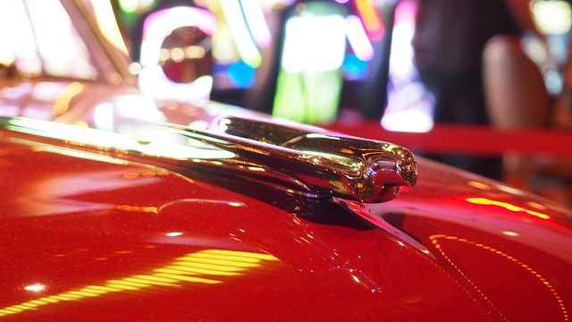 A hood ornament on an old car in the casino