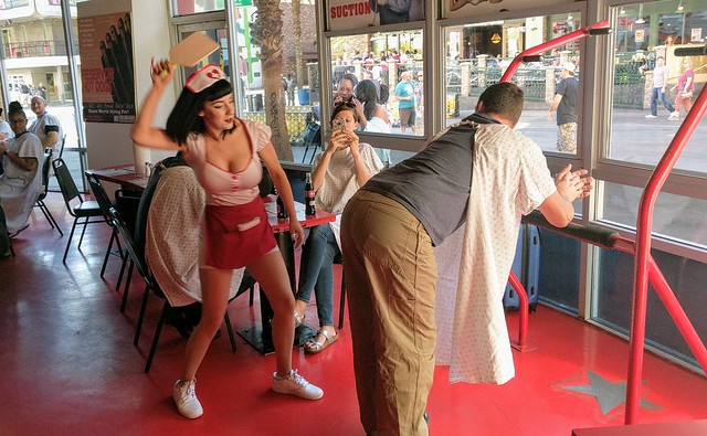 Chuck gets paddled by our waitress after not finishing his meal