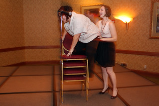 Helping Tia onto the chair