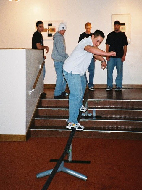 Brett Murdock sliding down the stairs