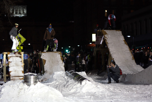 Snowboarders about to drop in