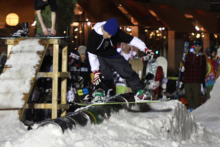 Snowboarding - Frontside tailslide across the kegs
