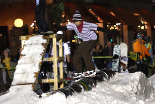 Snowboarding - Frontside Boardslide across the kegs