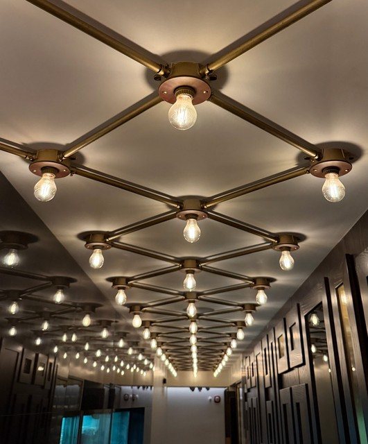 A fun surface mounted conduit and junction box lighting design