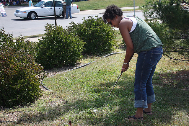 Drea trying beer golf