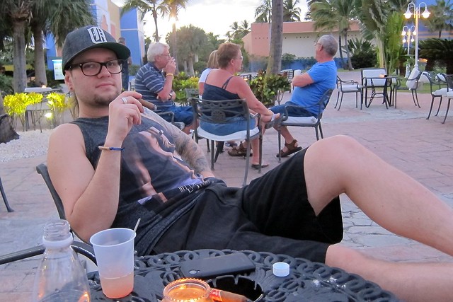 Flip flops. Shorts. Tank. Rum. Cigar