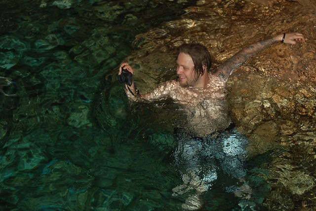 Taking photos, swimming in the cave