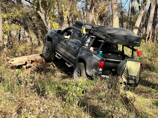 Tacoma trying to roll over the logs