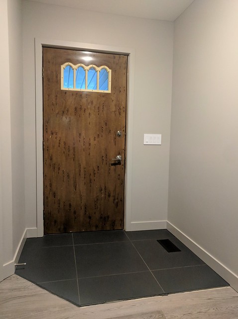 The original hand painted wood grain steel door.