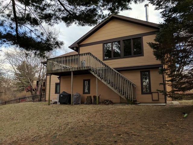 The back of the house and old "shed" below the deck.