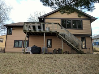 The back of the house and old "shed" below the deck.