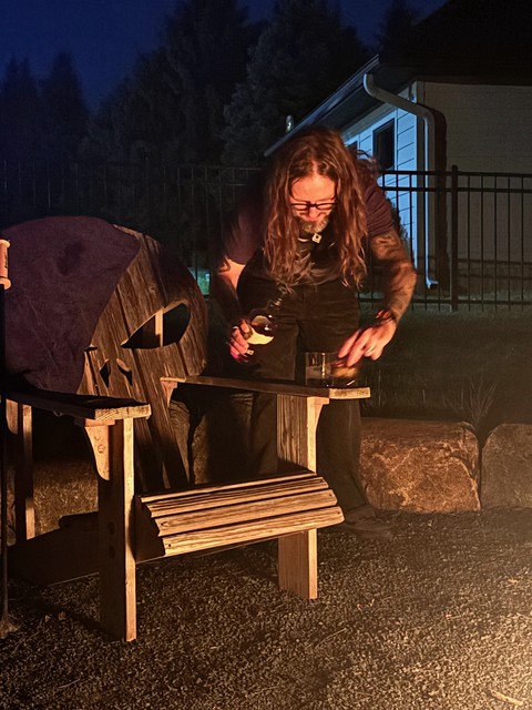 A fire, a cigar, and a pour of bourbon to end the night