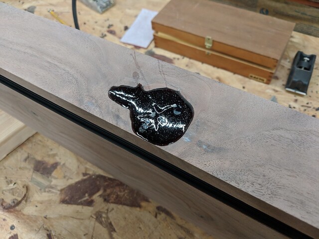 Filling a big knot in the front of the shelf... this whole process was new to me and felt so sketchy.