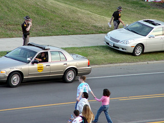Cops - Nevermind protecting the Jay-Walkers, we must protect these cars!