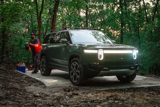 Evan is ready with the electric chainsaw