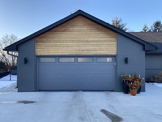 The stock paint is a bit off, but... we got a new garage door!