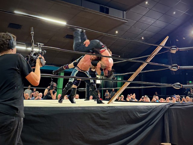 Davey Bang throws Bear through the door