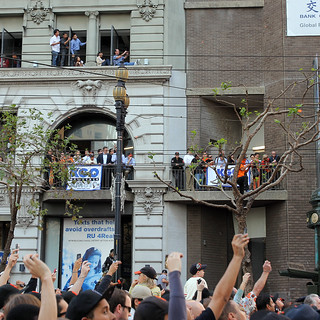 People hanging out of windows for the parade