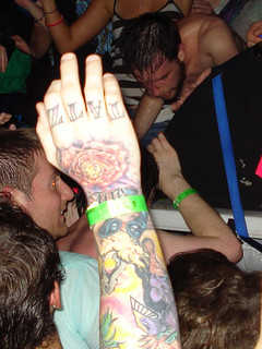 Tattoo - That dude's hand says "TATZ" I wonder if hi other hand says "RULE"