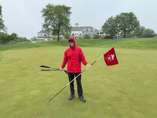I accidentally walked off with the flag a few holes back... so Ben had to capture this on the 18th.