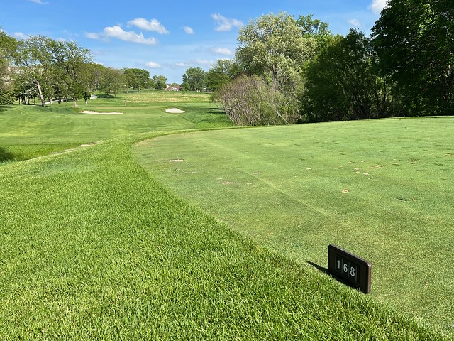 168 yards. Gnarly wind. 7 iron. Felt good. Looked good. 3 hops, a bit of a roll, left to right. Dropped right in