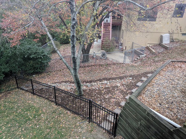 A dry stream and steps off to the side yard