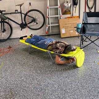 Teresa trying out Kari's reading lawn chair