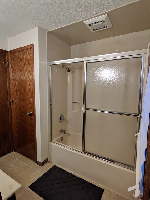 Dated / almond tub and shower and oak doors