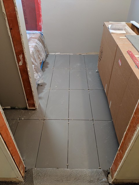 Floor tile going in
