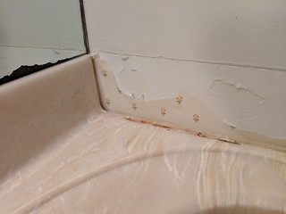 Found some pretty wallpaper behind the backsplash... I'm pretty sure my parents had this same wallpaper in our house in the 80s.