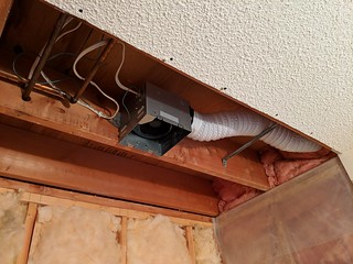 New bathroom fan installed.. the previous owners apparently added the fan or shower light later. This auxiliary wire was not to code.
