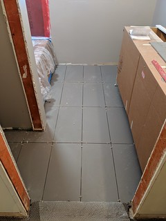 Floor tile going in