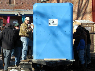 Bock Fest - A bunch of guys waiting in line for the urinal trailor while 4 guys pee on the back of it.